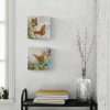 mini paintings of orange butterflies on the wall