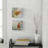 painting of mini orange butterflies on the wall.