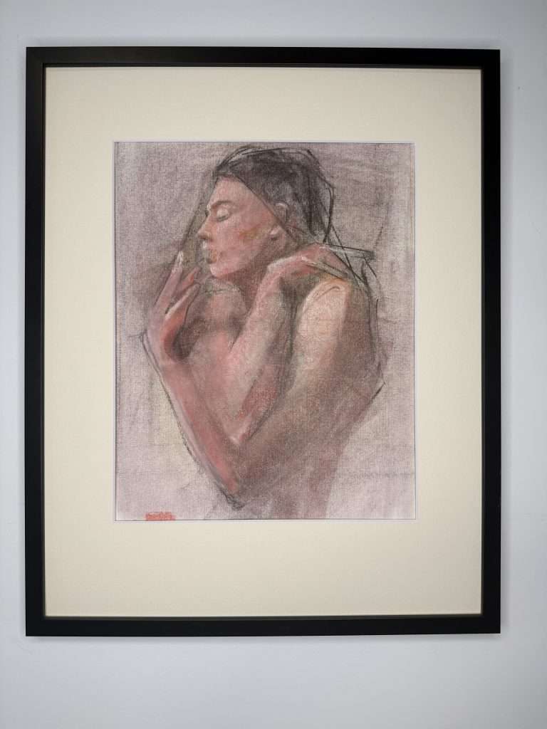 Expressive drawing of a woman in soft pink and peach tones with black hair, face in profile view to the left, her arms crossed and hand up and her face and shoulder.