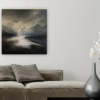 Night Whispers on wall behind a grey couch with a vase of flowers in the foreground.