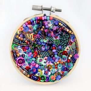 Resting Place, small mixed media textile embroidery hoop artwork by Samira Stephens with open spacing and soft textures.