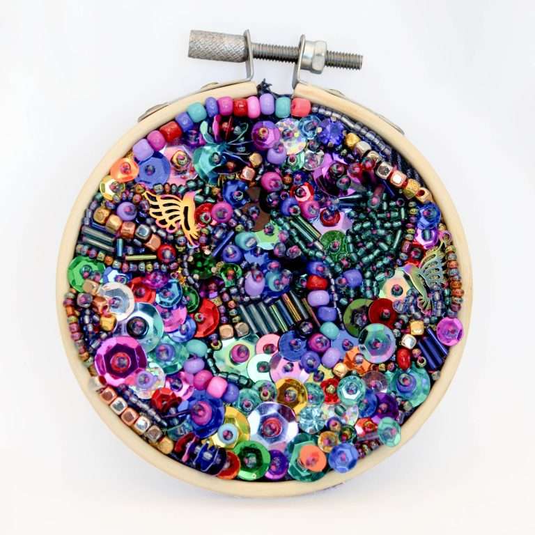Resting Place, small mixed media textile embroidery hoop artwork by Samira Stephens with open spacing and soft textures.